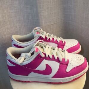 Fuchsia and White Low-Top Nike Dunks.